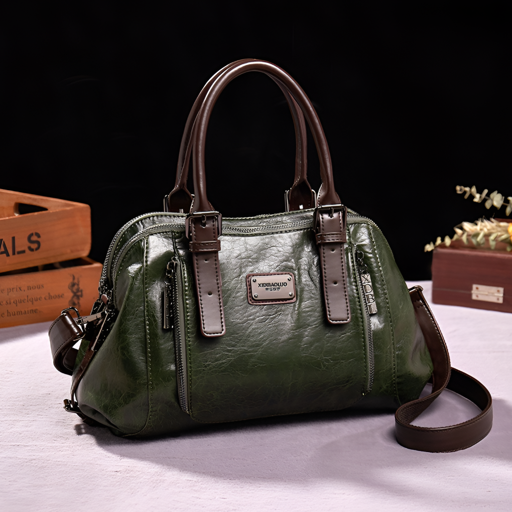 Close-up of a women's croc-embossed Boston handbag, highlighting the texture and elegant finish.