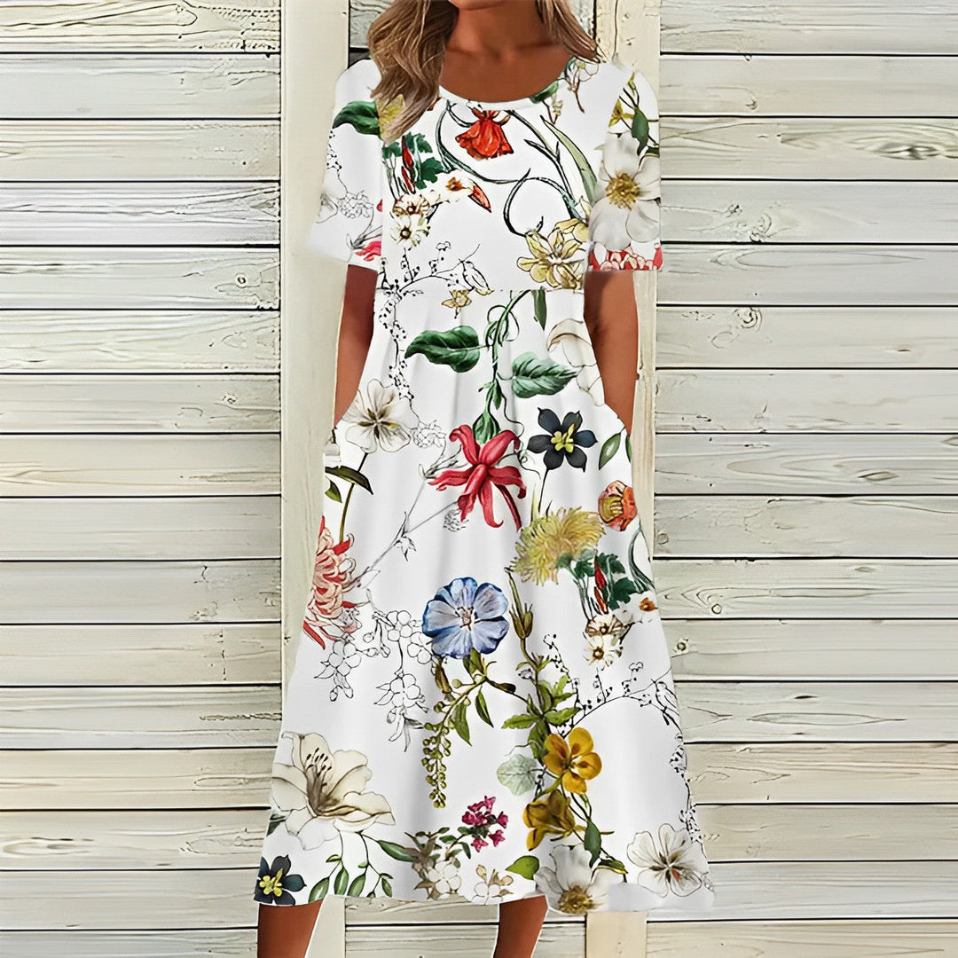 Elegant women's breezy floral print midi dress. Comfortable, flowy for summer vacations & casual spring fashion.