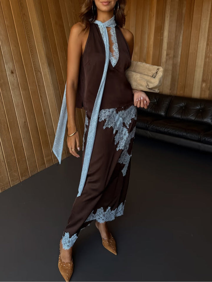 Women's elegant brown tie-dye maxi dress, featuring a flattering halter V-neck, flowing skirt & side slit.
