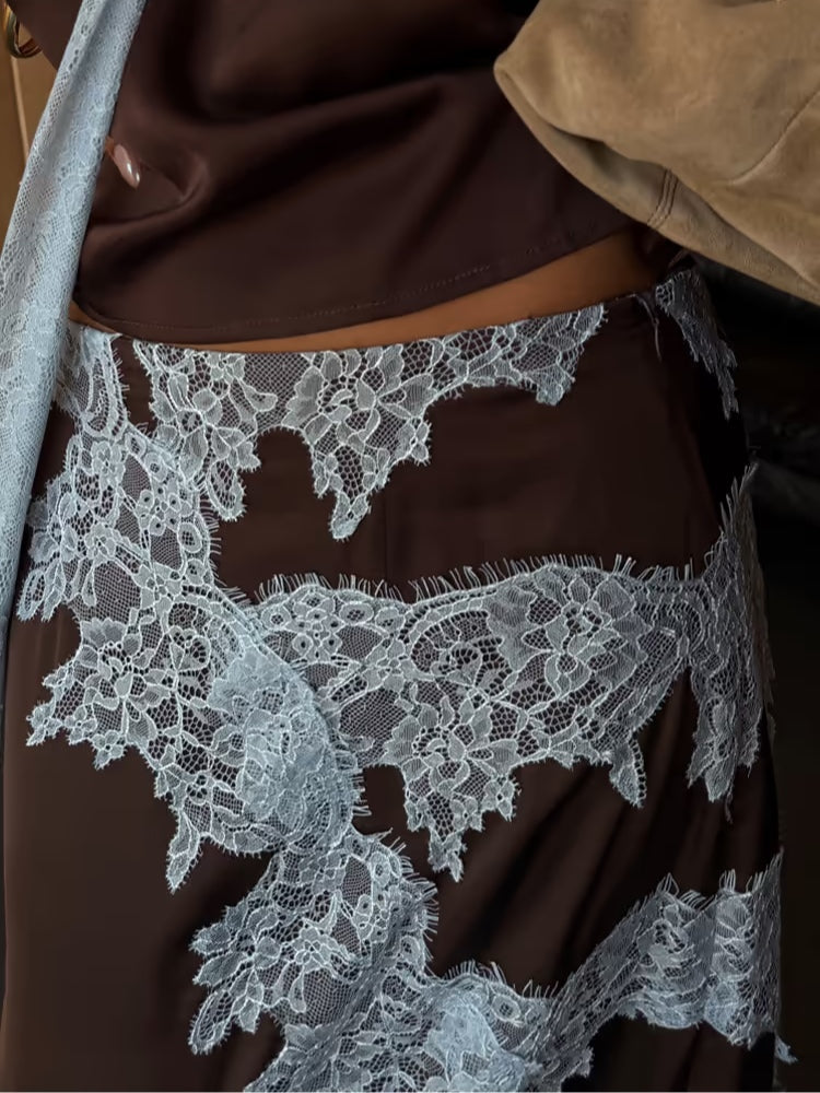 Stylish brown tie-dye maxi dress with a halter V-neck, flowing fabric, and an elegant side slit for women.