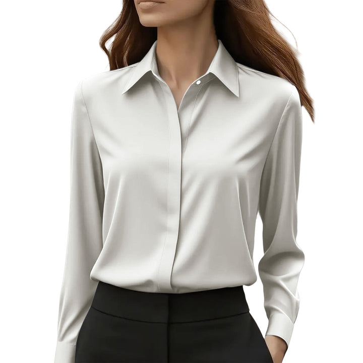 Elegant women's blouse with button-front closure, long sleeves, great for office and casual looks.