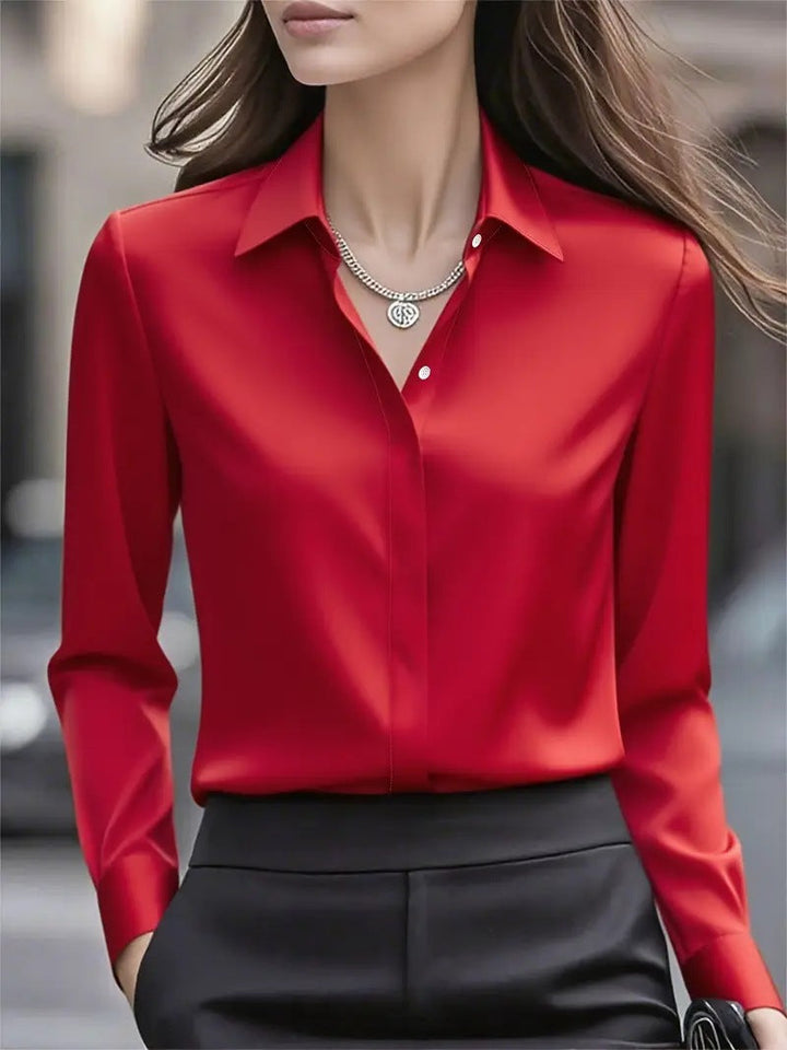 Ladies' button-front blouse, elegant and versatile for office wear or stylish casual outfits.