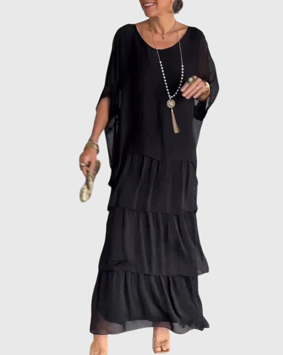 Long elegant women's dress, relaxed fit button-up maxi, suitable for special occasions.