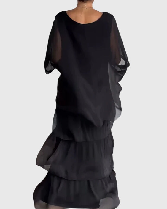 Flowy formal maxi dress for women, elegant button-up design with half sleeves.