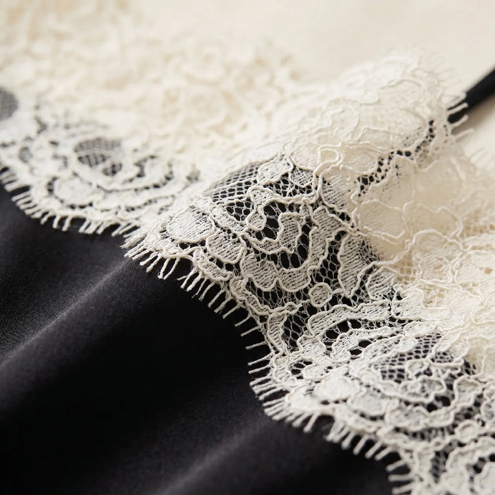 Chic women's camisole top with fine lace trim, a soft, comfortable sleeveless layering piece.