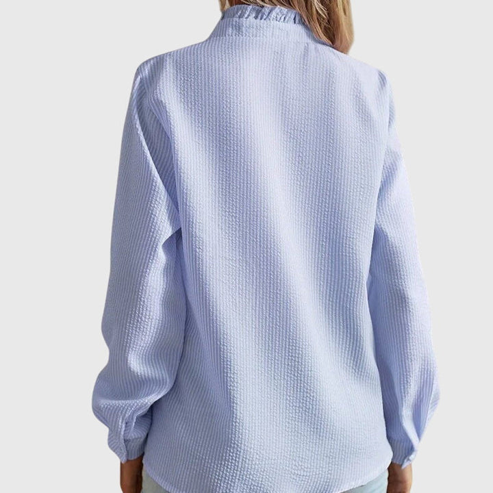 Chic women's long sleeve blouse with a flattering fit, ideal for elegant office wear or spring fashion.
