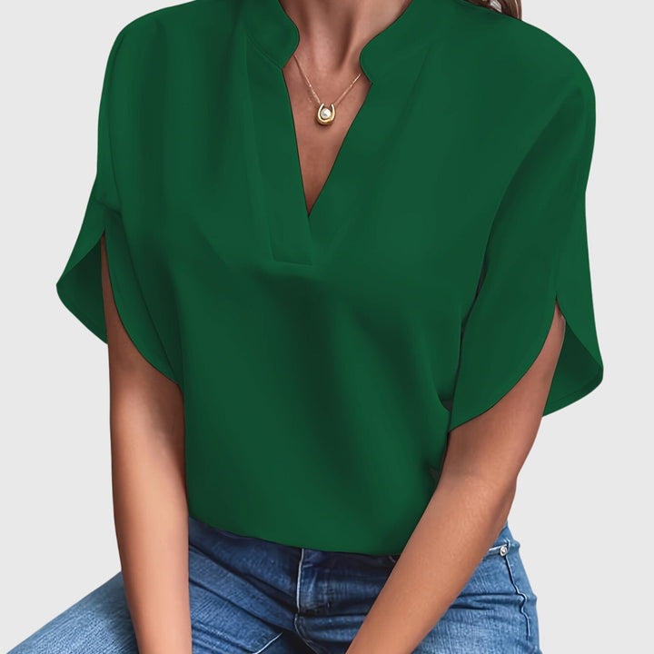 Chic women's top, elegant blouse perfect for casual wear or professional settings.