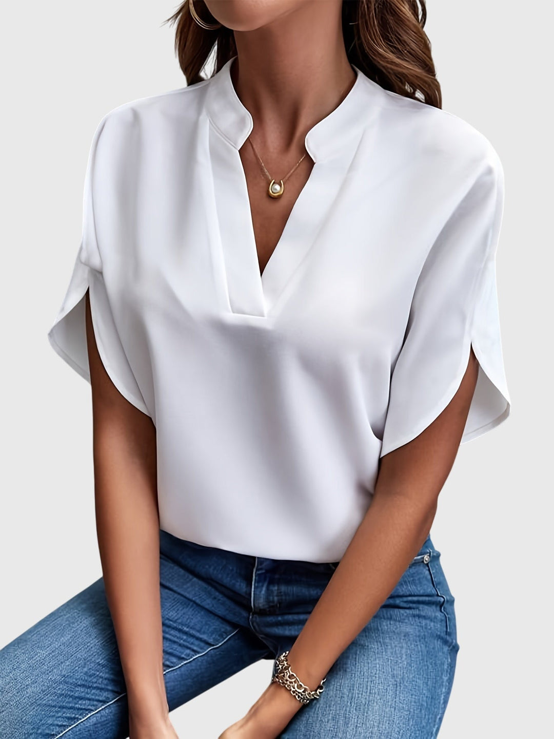 Stylish women's blouse, chic office wear top, adaptable for casual occasions.
