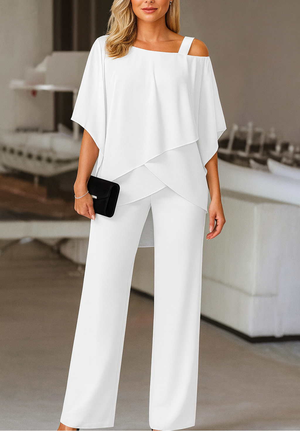Model wearing women's elegant cold-shoulder pants set, ideal for sophisticated party or vacation style.