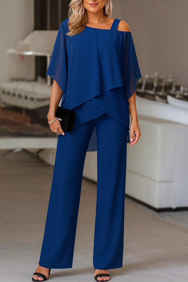 Modern women's two-piece pants set with cold-shoulder top. Elegant and chic for various occasions.