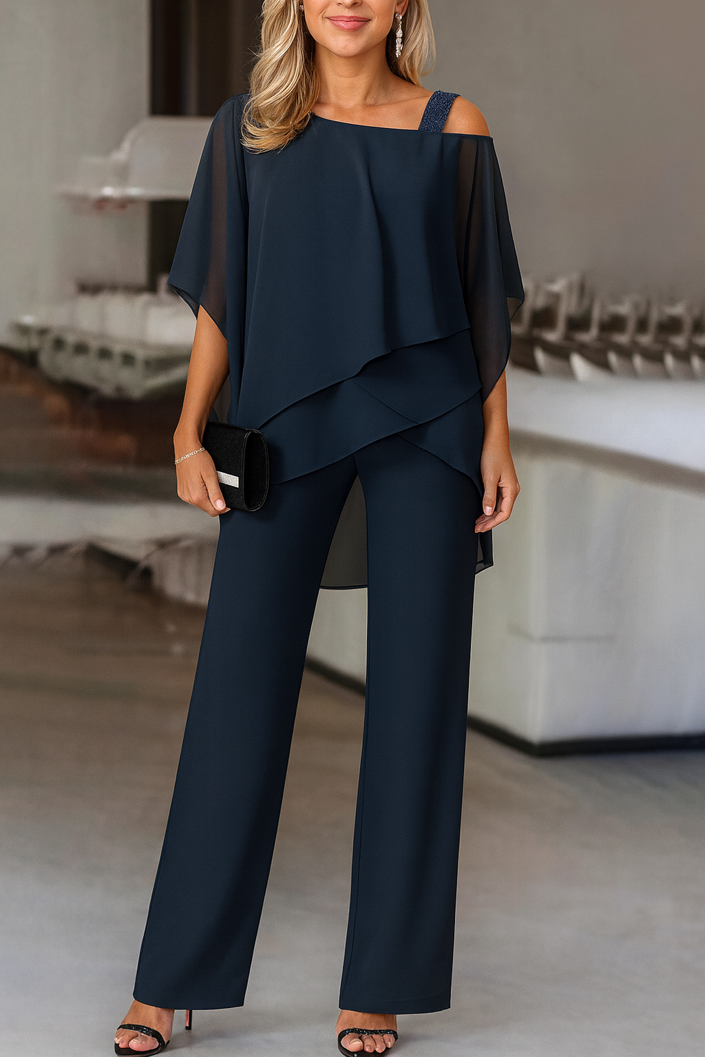 Versatile women's cold-shoulder two-piece pants set. Elegant, chic, and comfortable for parties or travel.