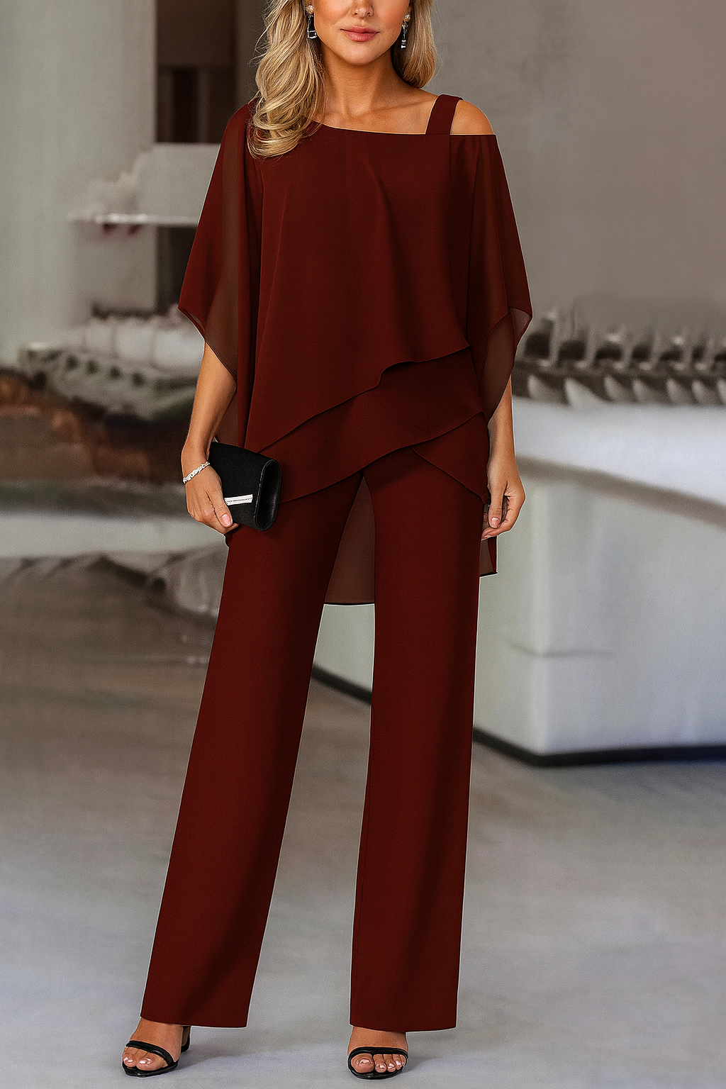 Stylish women's cold-shoulder top & matching pants set. An elegant two-piece outfit for modern fashion.