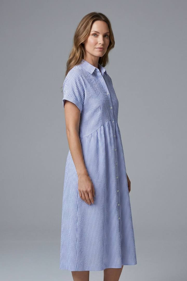 Close-up of the collared neckline and button-front detail on this elegant women's midi dress.