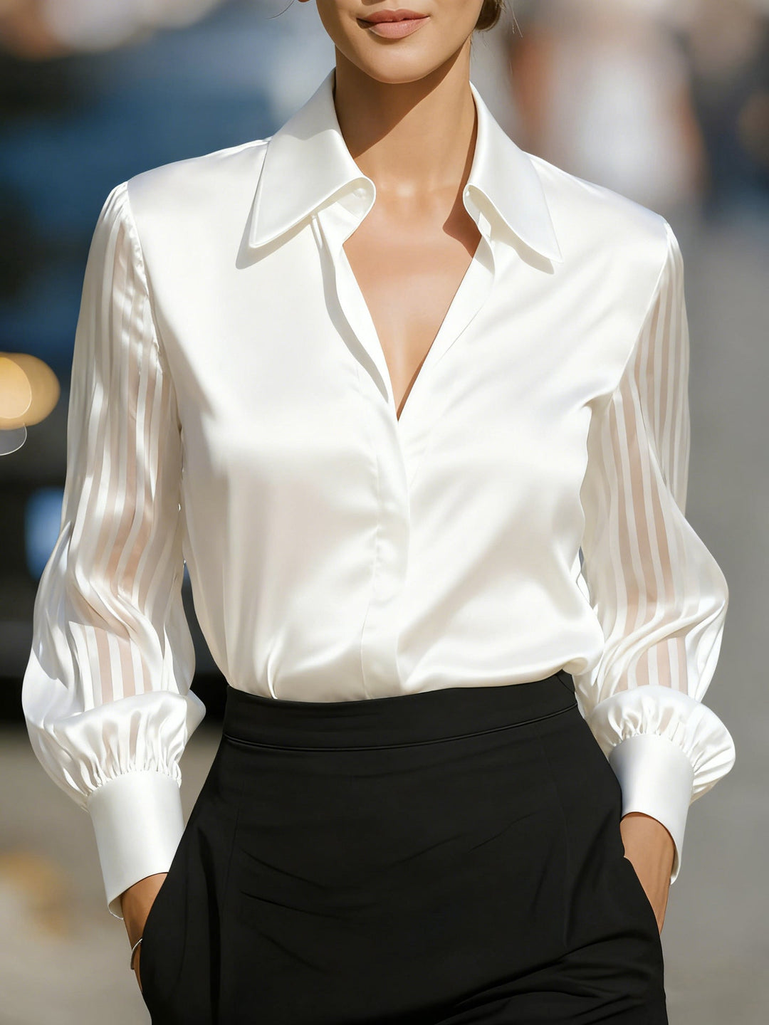 Sophisticated sheer stripe blouse for women, featuring a collar and button-up front, ideal for work.