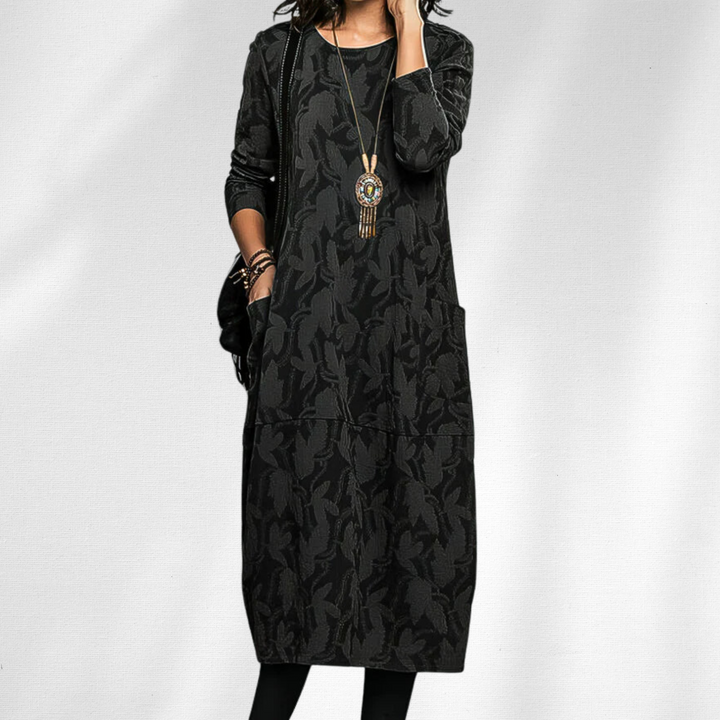 Stylish women's elegant midi dress. Cozy long sleeve crewneck design for winter & fall comfort. Features convenient pockets.