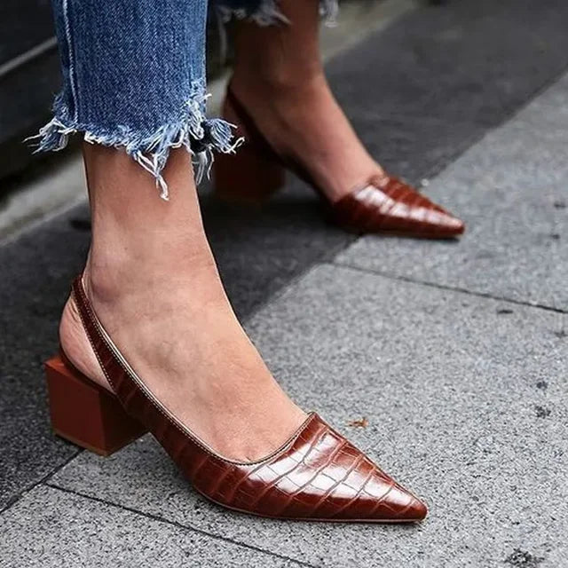 Elegant women's croco print slingback heels. Stylish comfort for formal or everyday wear. Fashionable dress shoes.