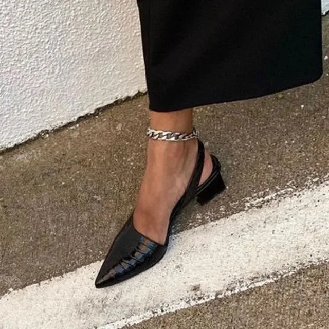 Comfortable women's croco print slingback heels. Supportive design for all-day elegance in formal footwear.