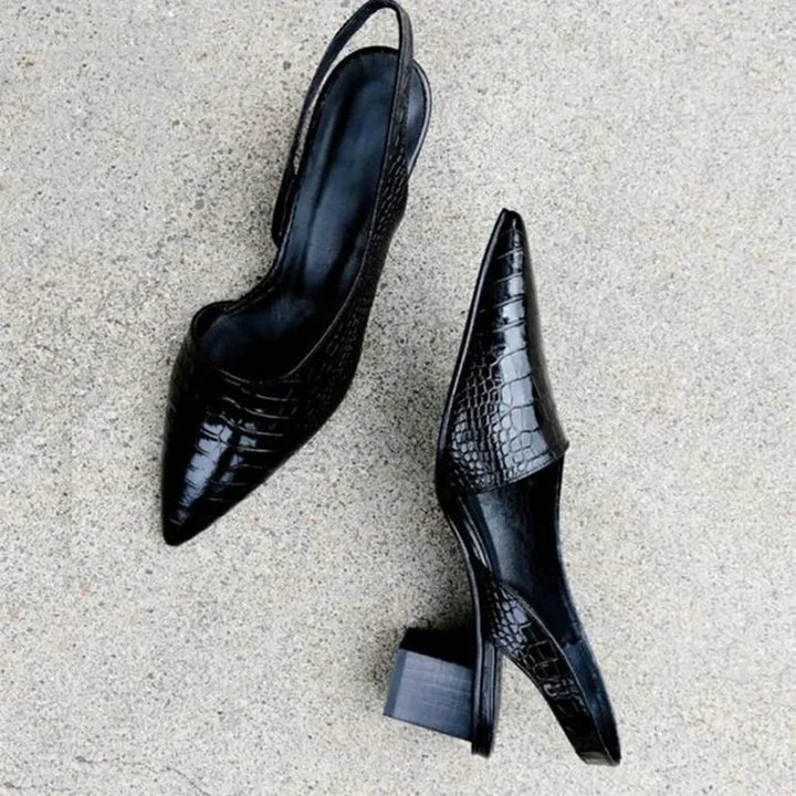 Black croco print slingback heels for women. Chic comfort, perfect for formal events or adding everyday elegance.