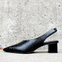 Fashionable women's croco print slingback heels. Supportive comfort design for elegant dress shoes, perfect for any event.