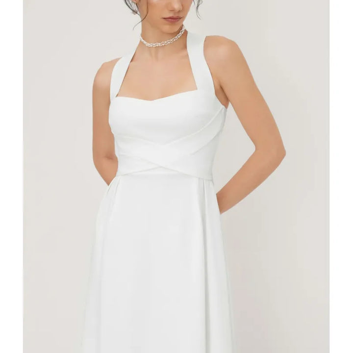 Versatile sleeveless midi dress with elegant square neck & cross-waist, ideal for summer fashion & chic looks.