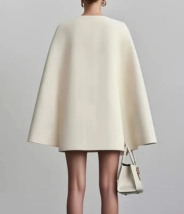 Chic women's formal mini dress with double-breasted front and elegant cape sleeves. Ideal for business wear.