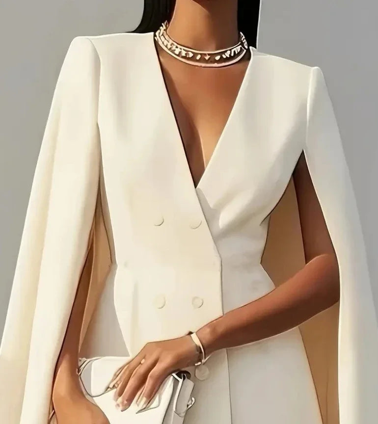 Tailored women's mini dress featuring a double-breasted design and sophisticated cape sleeves. Party perfect.