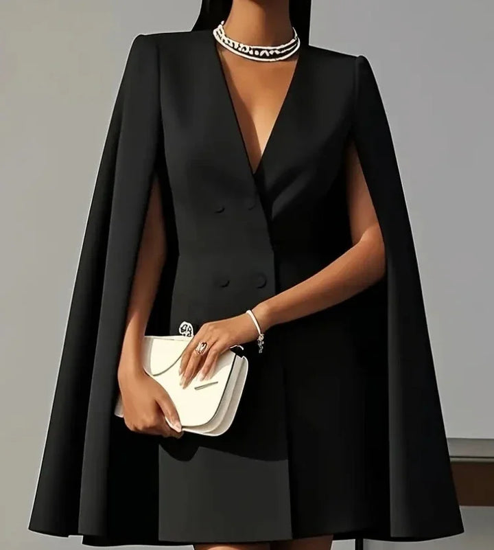 Stylish women's cocktail mini dress, double-breasted button front, and chic cape sleeves. Formal & trendy.