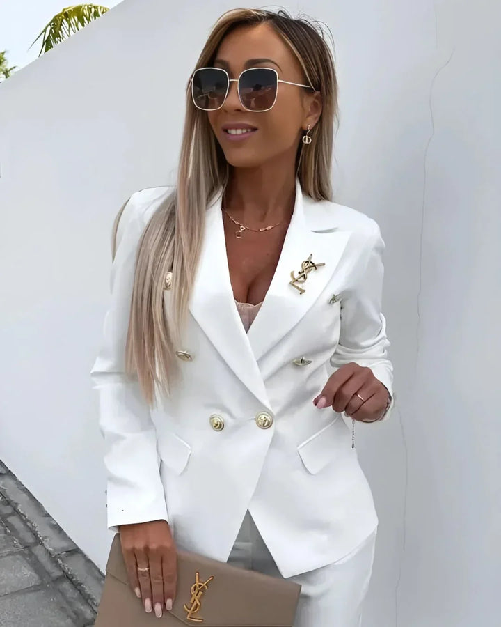 Womenswear double-breasted tailored suit, a stylish two-piece blazer & trousers for business.