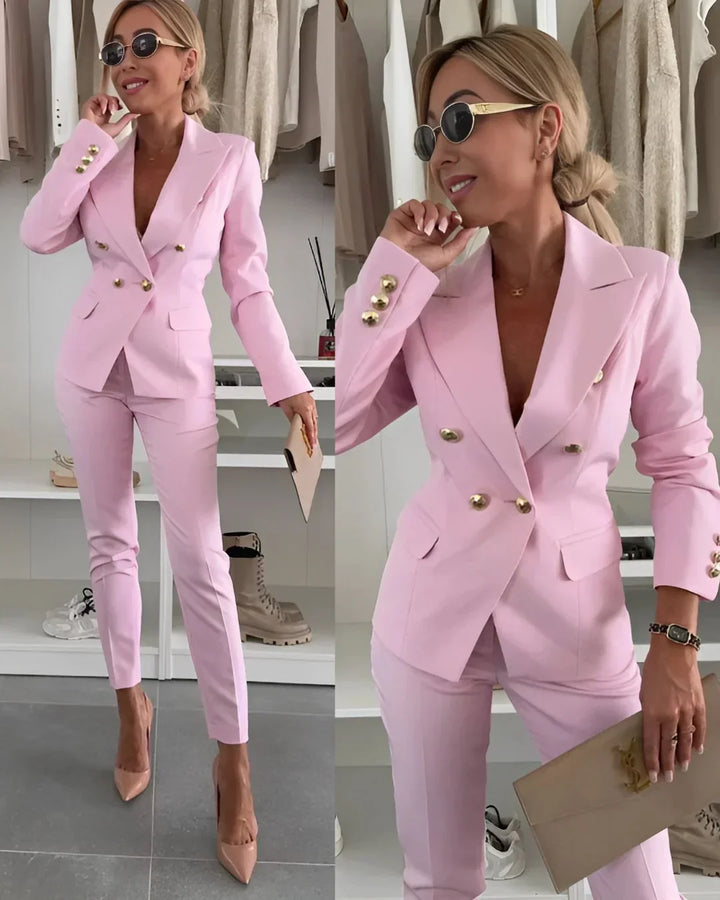 Classic women's formal outfit: a tailored double-breasted blazer and comfortable trousers set.