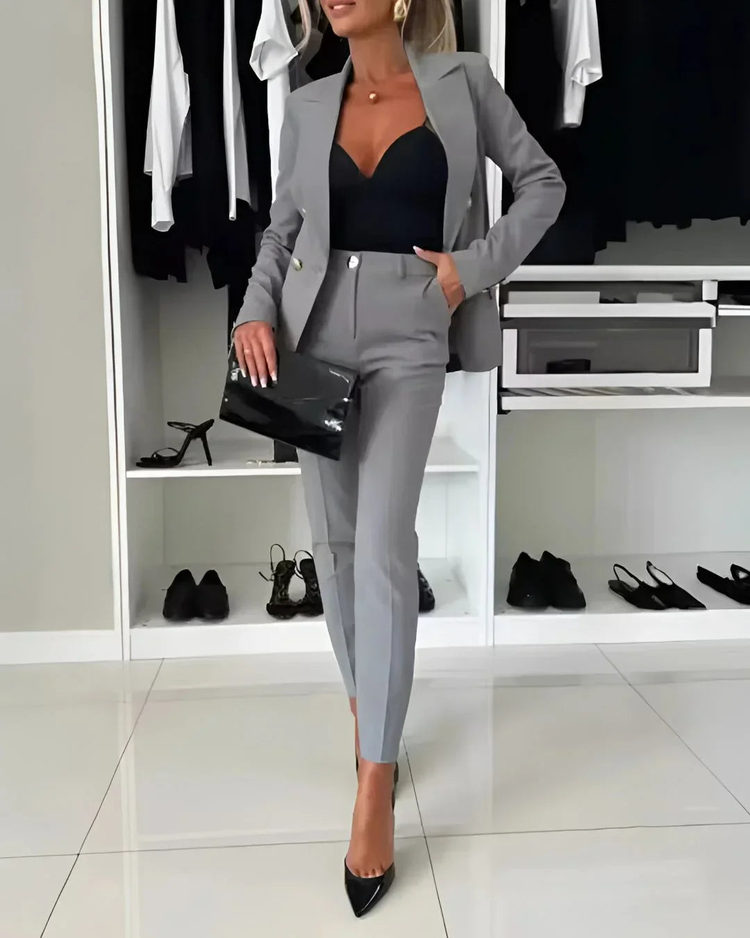 Sophisticated women's tailored suit, a double-breasted blazer & trousers ensemble for formal events.