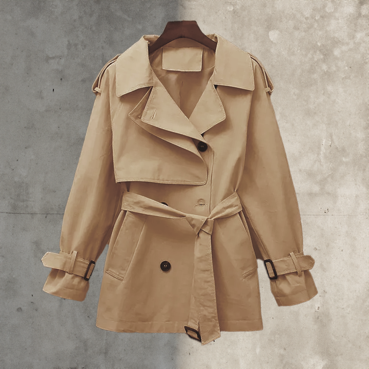 Versatile women's belted trench coat, double-breasted design, ideal transitional jacket for autumn & spring.