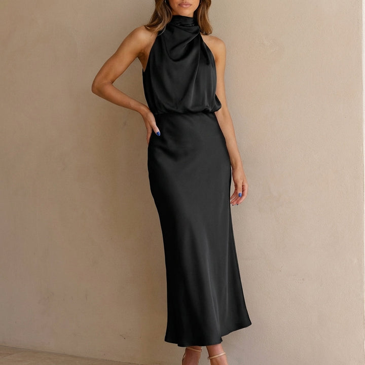 Sophisticated women's sleeveless midi dress featuring a draped halter neck and blouson waist for formal events.