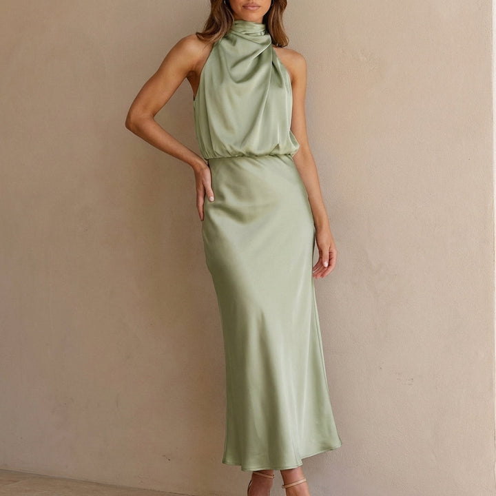 Women's elegant evening dress: a draped halter neck midi with a flattering blouson waist.