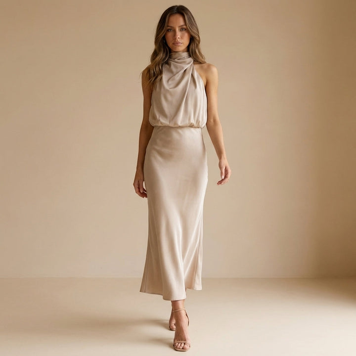 Fashionable women's midi dress with a draped halter neck, blouson waist, and elegant evening wear design.