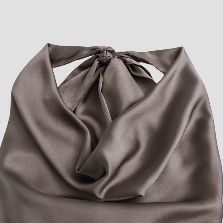 Draped halter neck tank top for women, offering a chic and elegant style for summer fashion.