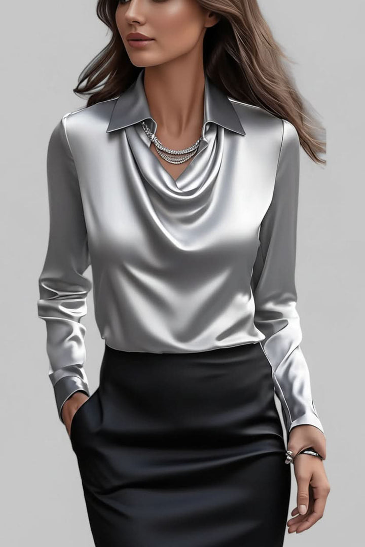 Sophisticated women's fashion top, featuring a flattering draped design and long sleeves for day to night.