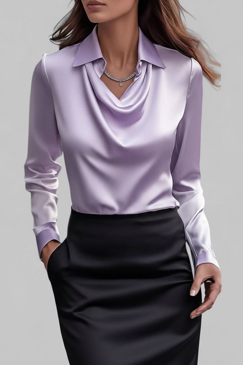 Women's stylish draped long sleeve top, an elegant choice for work or a fashionable party outfit.