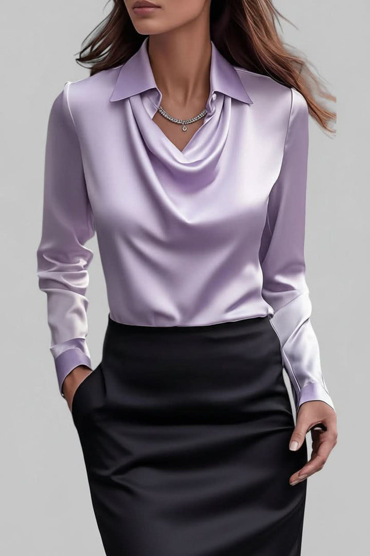 Women's stylish draped long sleeve top, an elegant choice for work or a fashionable party outfit.