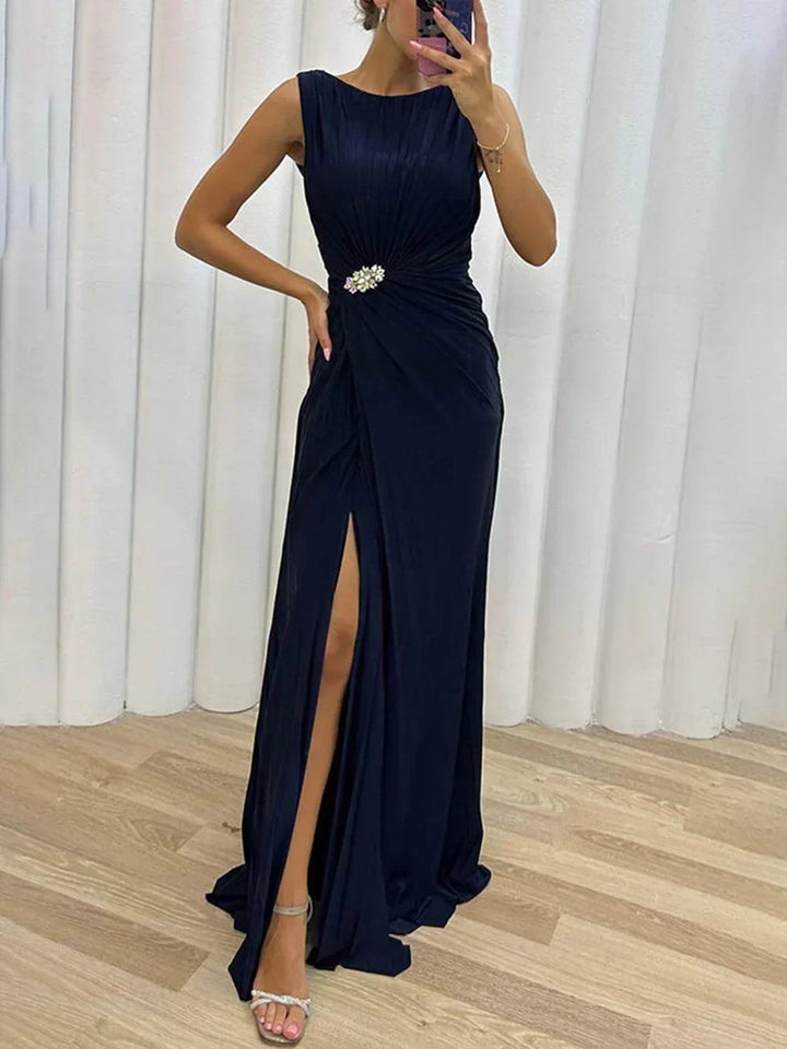 Sleeveless women's draped maxi wedding guest dress with elegant flowing fabric for special occasions.