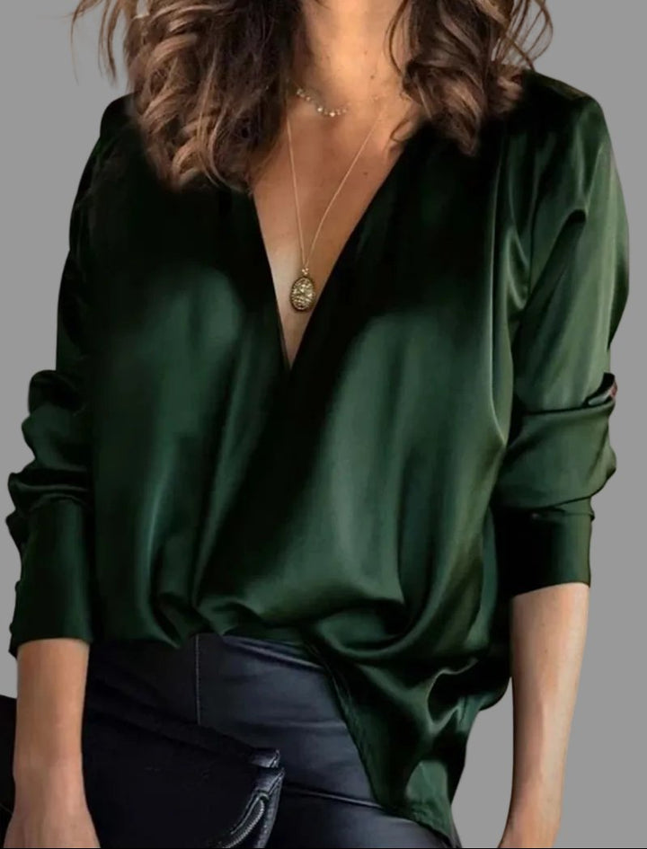 Elegant women's draped V-neck blouse with a relaxed fit, perfect for any occasion. Versatile long sleeve fashion top.