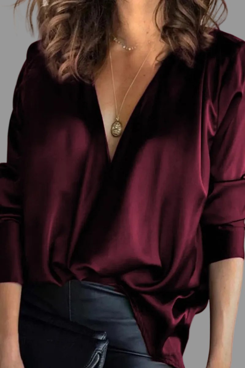 Stylish green draped V-neck blouse for women. Elegant relaxed fit, ideal for evening wear or formal events.