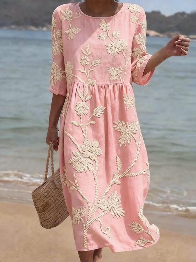 Versatile women's midi dress featuring intricate floral embroidery and comfortable three-quarter sleeves.