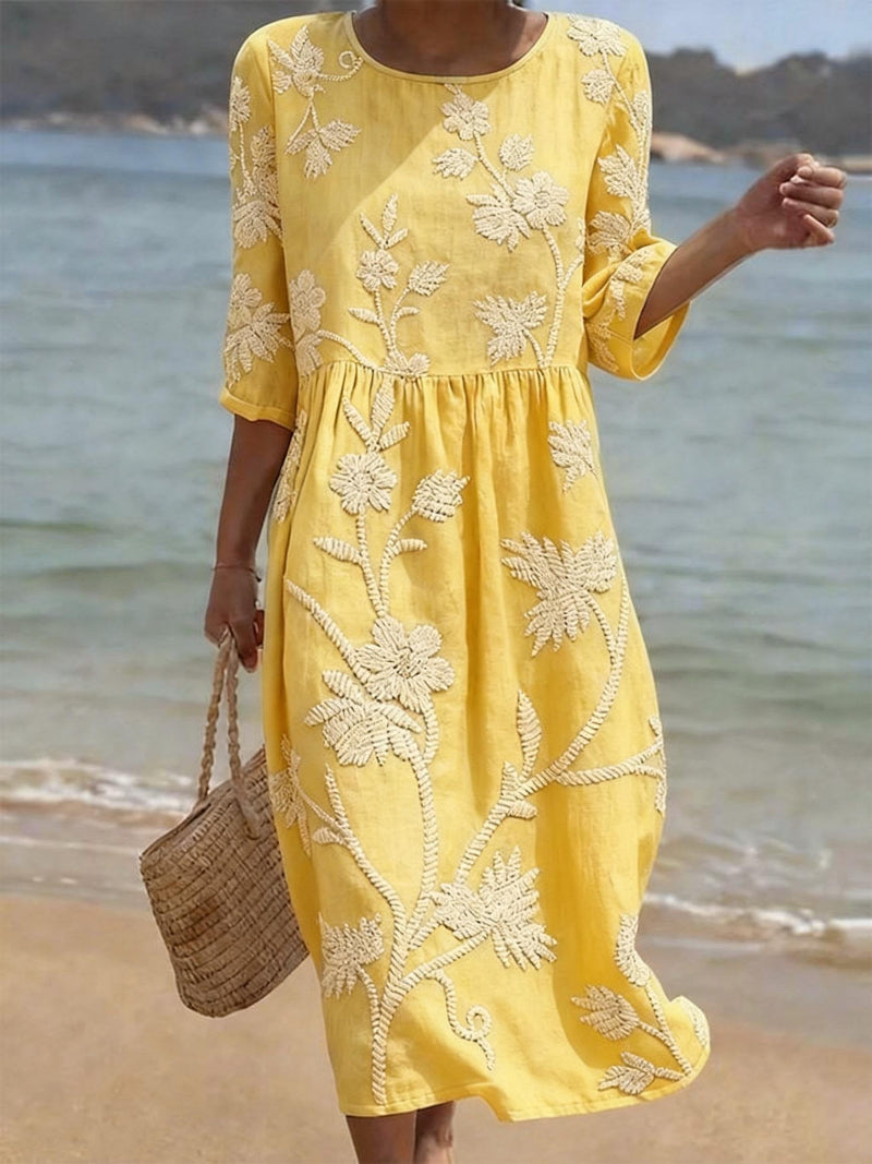 Chic round neck women's midi dress with beautiful floral embroidery, ideal for casual or elegant styles.