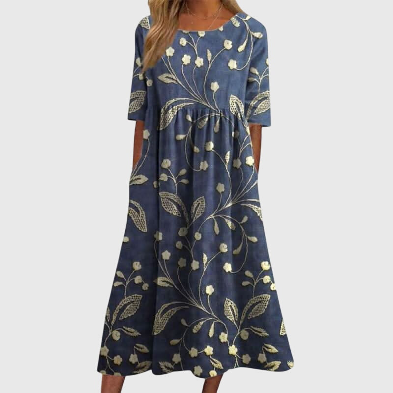 Elegant women's embroidered flowy midi dress in vibrant red, perfect for summer casual or occasion wear.