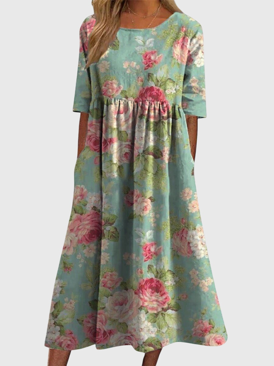 Close-up of intricate embroidery on a comfortable, relaxed-fit women's flowy midi dress.