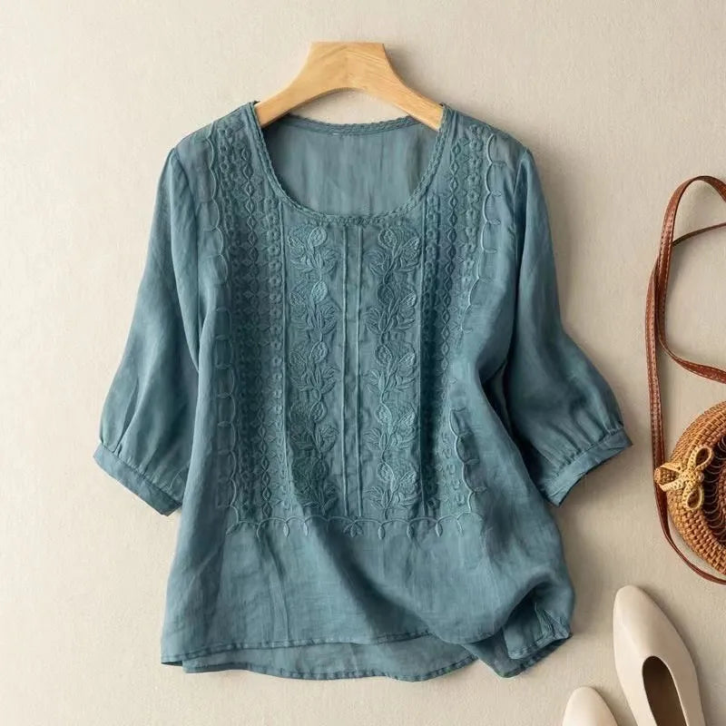 Comfortable women's puff sleeve blouse with floral embroidery, three-quarter sleeves, and a stylish loose fit.