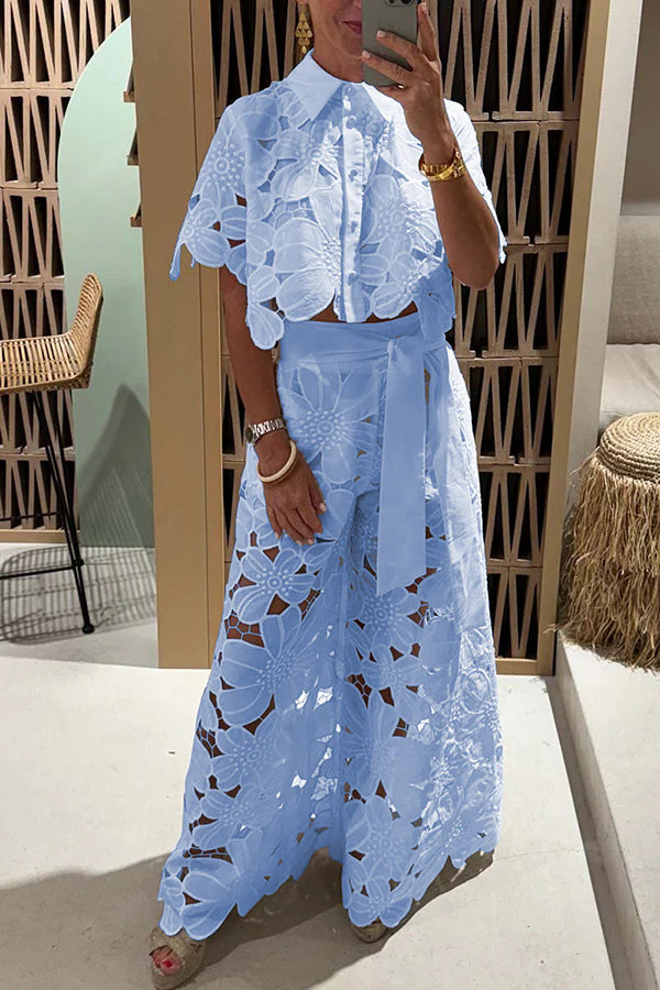 Chic women's eyelet embroidered two-piece set with delicate ruffle sleeves. Comfortable summer outfit for elegant events.