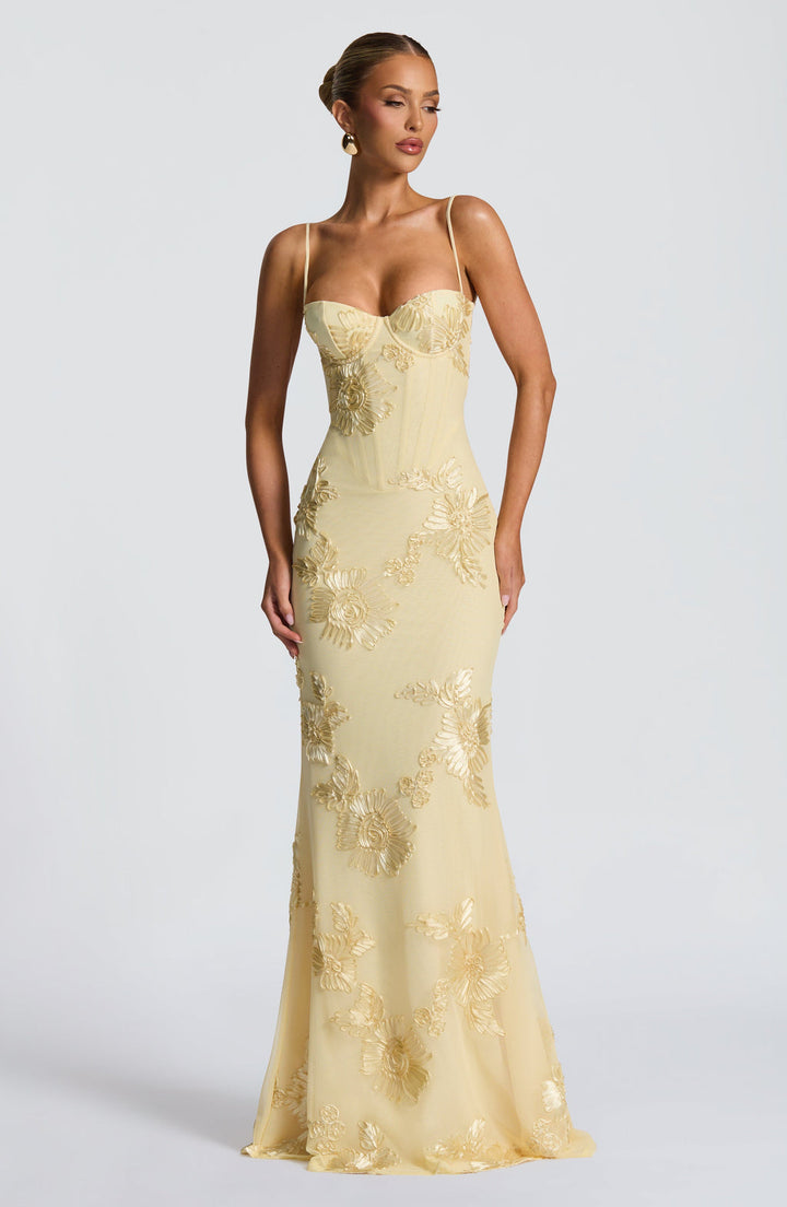 Stunning mermaid gown with intricate floral appliques, a sophisticated choice for prom or special occasions.