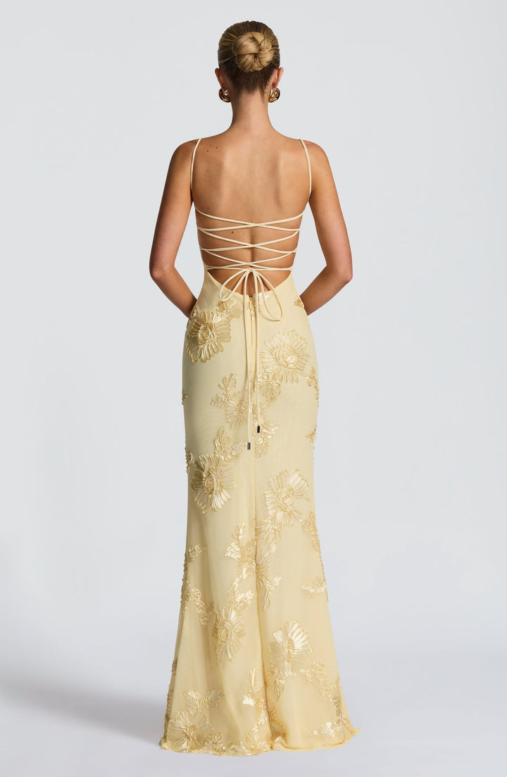 Women's elegant spaghetti strap maxi dress, designed with beautiful floral details for formal wear.