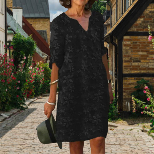 Summer women's casual midi dress featuring beautiful floral appliqué, 3/4 sleeves, and a stylish notch neck.